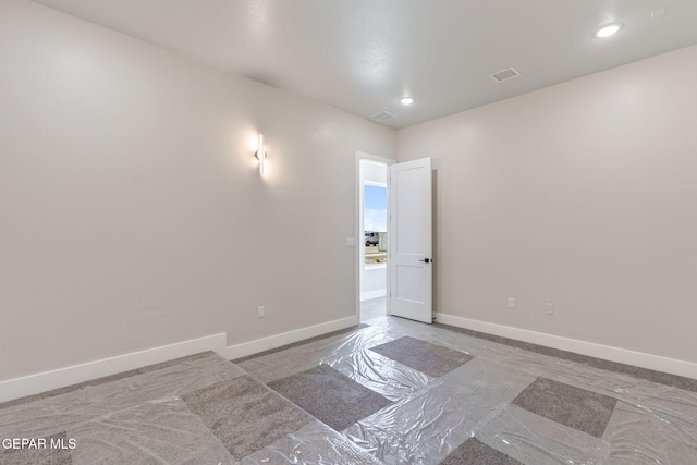 unfurnished room with recessed lighting, baseboards, and visible vents