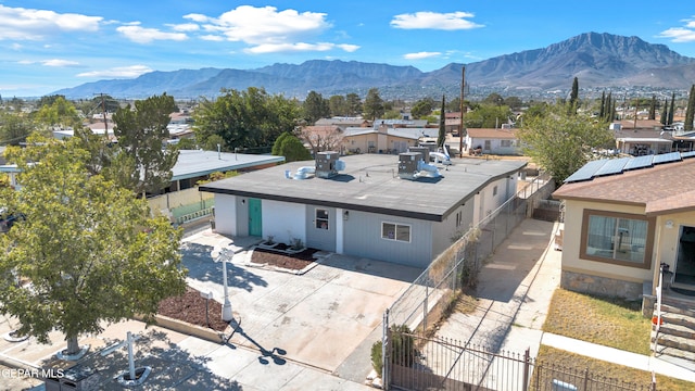 birds eye view of property with a mountain view