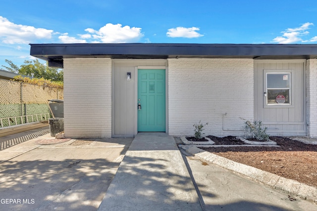 doorway to property with a patio