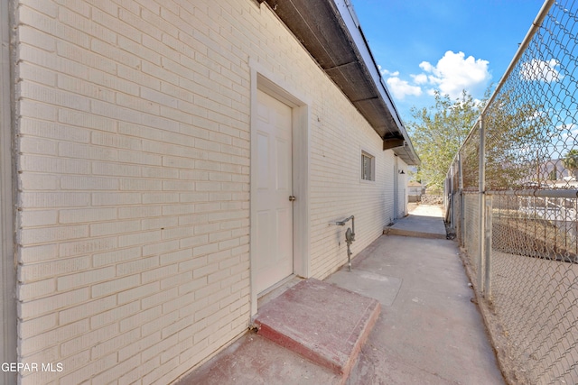 view of side of home with a patio area