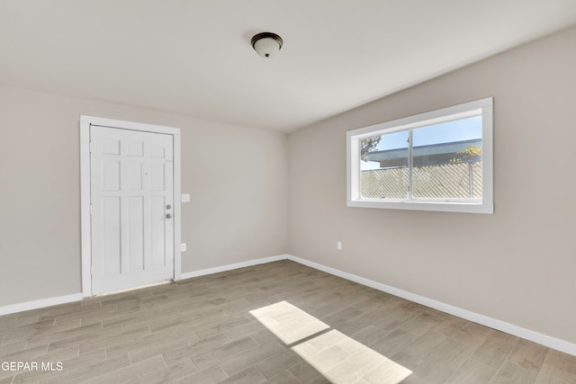 unfurnished room with light hardwood / wood-style flooring