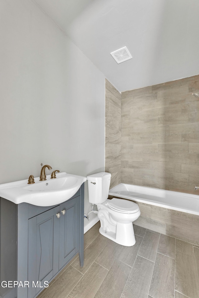 bathroom with toilet and vanity