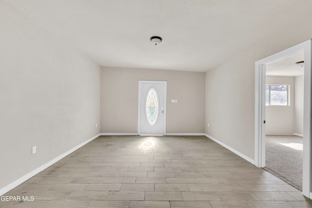 entryway with light hardwood / wood-style flooring and a wealth of natural light