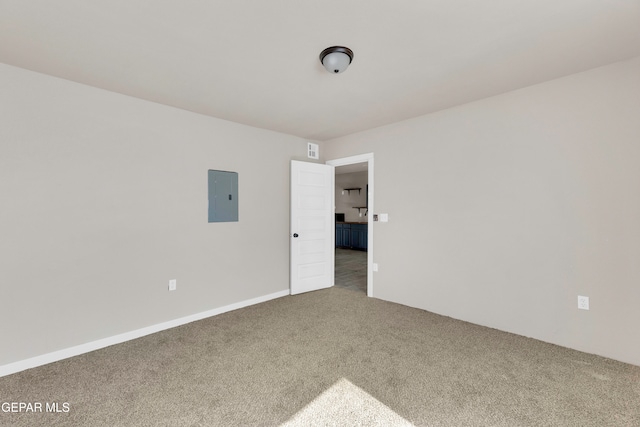 carpeted empty room with electric panel