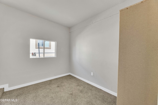 unfurnished room with carpet flooring