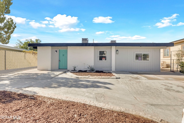 rear view of property featuring a patio area