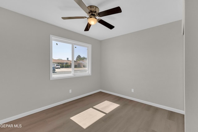 spare room with ceiling fan and hardwood / wood-style floors