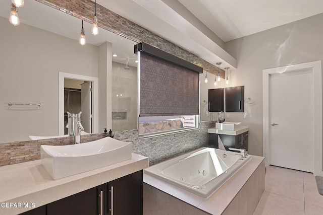 bathroom featuring vanity, shower with separate bathtub, and tile patterned floors