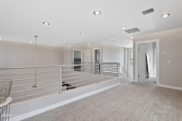 hallway with carpet flooring