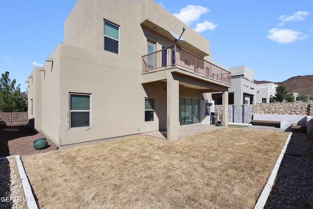 rear view of house with a patio