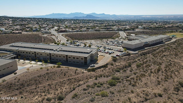 birds eye view of property featuring a mountain view