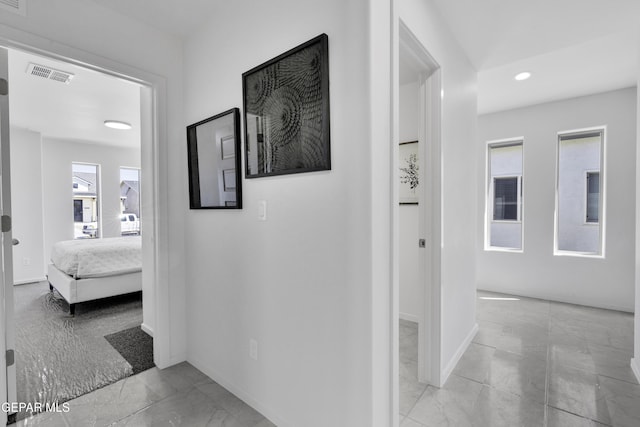 15248 Gauge Ct, El Paso, TX 79938 - corridor featuring baseboards, visible vents, recessed lighting, and marble finish floor