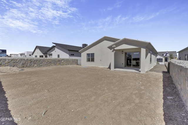 15248 Gauge Ct, El Paso, TX 79938 - back of property with central air condition unit, a patio, a fenced backyard, and stucco siding