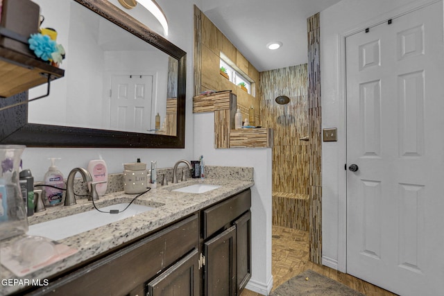 bathroom featuring vanity and a shower