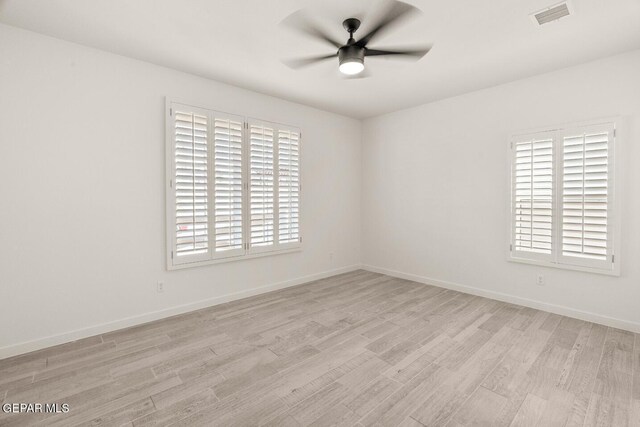 13397 Highworth Dr, El Paso, TX 79928 - empty room featuring visible vents, a ceiling fan, light wood finished floors, and a wealth of natural light