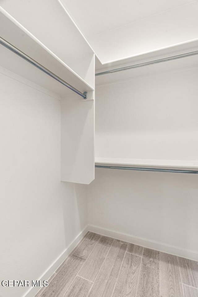 13397 Highworth Dr, El Paso, TX 79928 - spacious closet featuring light wood-style flooring