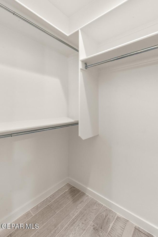 13397 Highworth Dr, El Paso, TX 79928 - walk in closet with wood finished floors