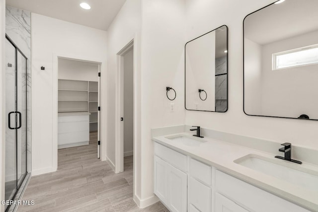 13397 Highworth Dr, El Paso, TX 79928 - bathroom featuring a sink, a stall shower, and a spacious closet
