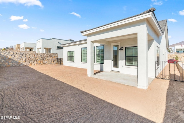 13397 Highworth Dr, El Paso, TX 79928 - back of house with a patio, stucco siding, and fence
