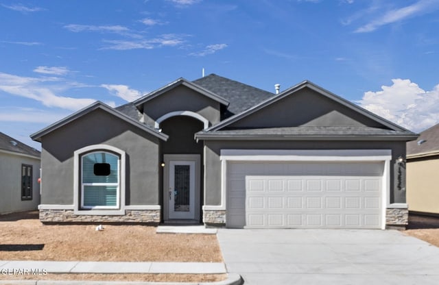 1229 Night Sky St, El Paso, TX 79928 - ranch-style home featuring an attached garage, concrete driveway, stone siding, and stucco siding