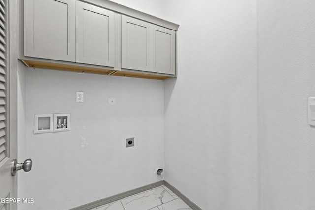 1229 Night Sky St, El Paso, TX 79928 - laundry area with electric dryer hookup, light marble finish flooring, cabinet space, hookup for a washing machine, and baseboards