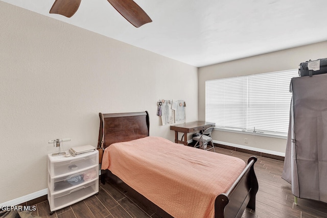 bedroom featuring ceiling fan and dark hardwood / wood-style floors