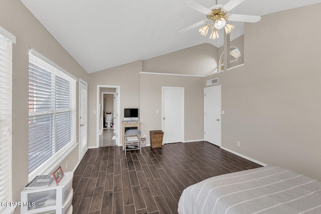 bedroom featuring dark wood-type flooring, a textured ceiling, high vaulted ceiling, and ceiling fan