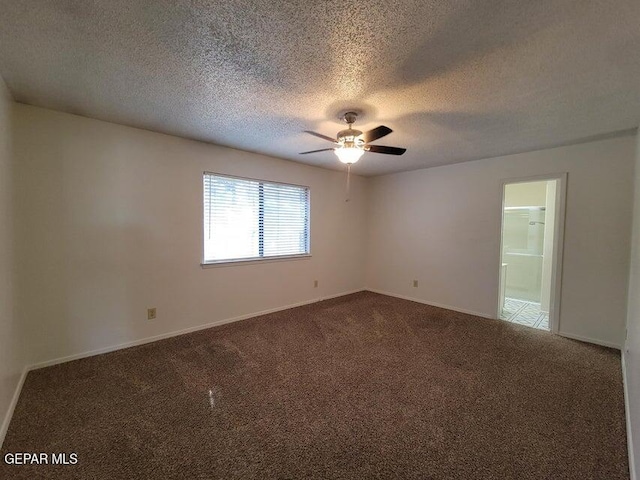 carpeted empty room featuring a textured ceiling and ceiling fan