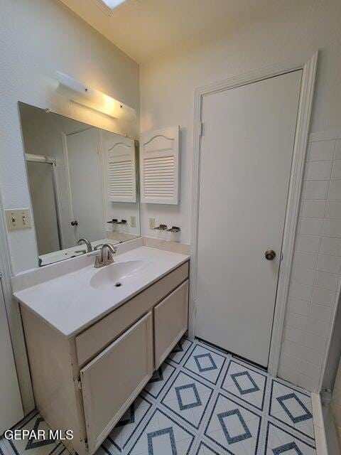 bathroom with vanity and an enclosed shower