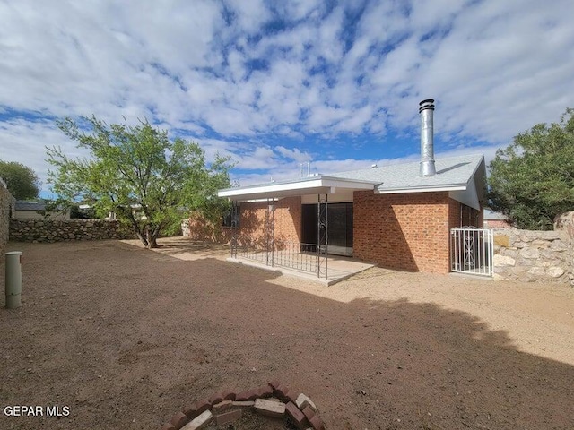 back of house with a patio area