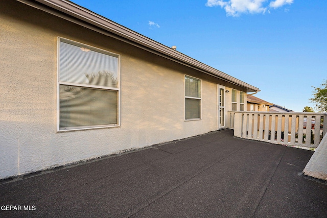 view of side of home with a patio area