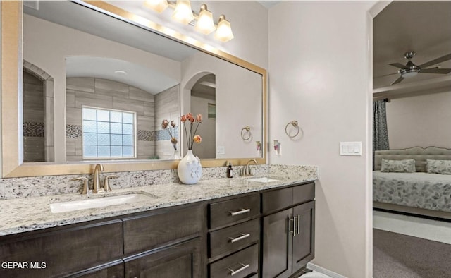 bathroom with vanity, vaulted ceiling, and ceiling fan