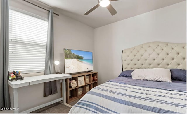 bedroom featuring ceiling fan and carpet floors