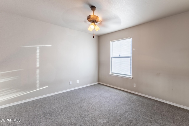 empty room featuring carpet and ceiling fan