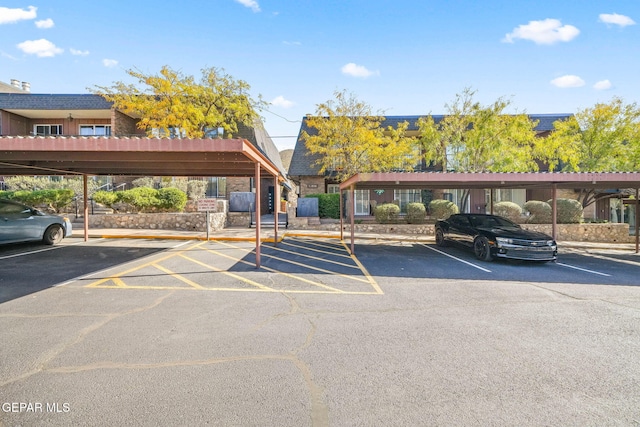 view of parking / parking lot featuring a carport