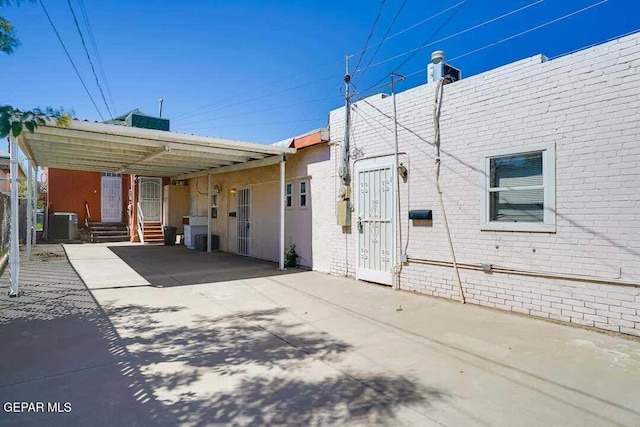 view of home's exterior featuring a carport