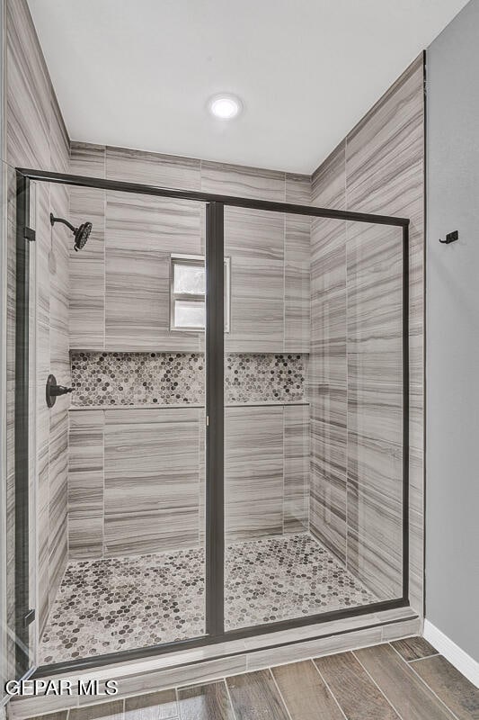 bathroom with an enclosed shower