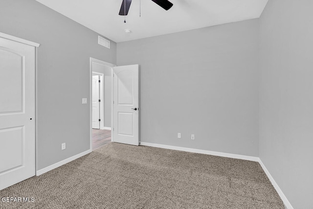 unfurnished bedroom featuring carpet flooring and ceiling fan