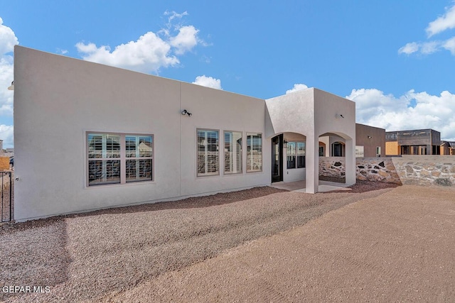13645 Prime Vista Ct, El Paso, TX 79928 - back of house with stucco siding and a patio