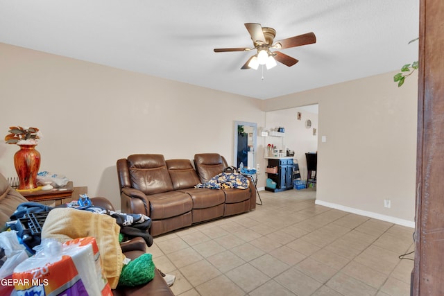 living room with ceiling fan and light tile patterned floors