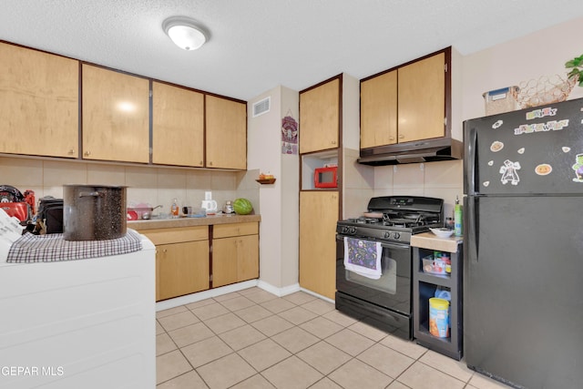 kitchen featuring black appliances, decorative backsplash, and light tile patterned flooring