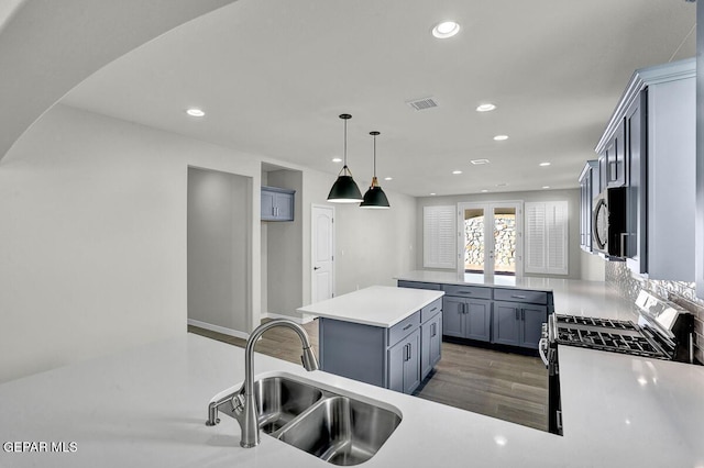 13653 Prime Vista Ct, El Paso, TX 79928 - kitchen featuring appliances with stainless steel finishes, gray cabinets, recessed lighting, light countertops, and wood finished floors