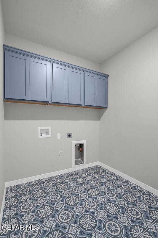 laundry area with cabinets, hookup for a washing machine, gas dryer hookup, and electric dryer hookup