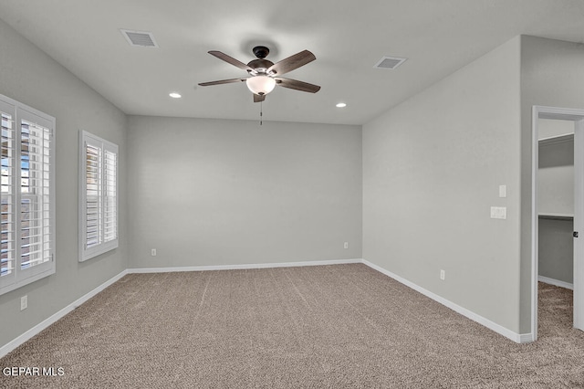 carpeted empty room with ceiling fan