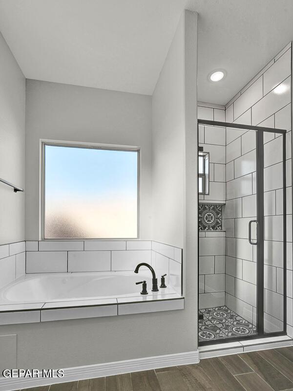 13653 Prime Vista Ct, El Paso, TX 79928 - bathroom with a bath, wood finished floors, and a stall shower
