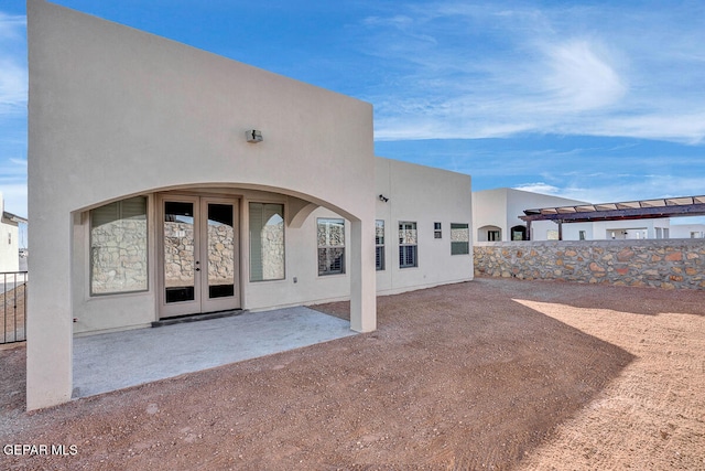 rear view of property with a patio and french doors