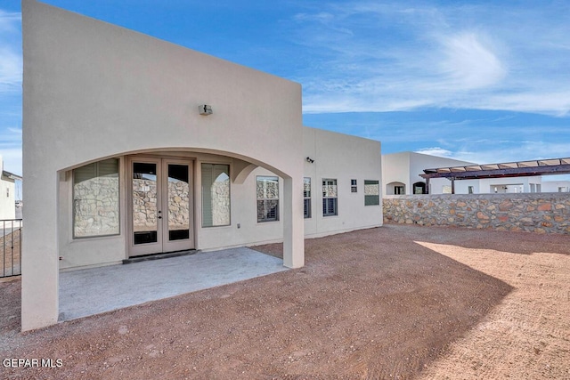 13653 Prime Vista Ct, El Paso, TX 79928 - rear view of house featuring french doors, stucco siding, and a patio
