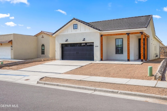 13866 Paseo Central Ave, El Paso, TX 79928 - view of front of property featuring stucco siding, a tiled roof, and concrete driveway