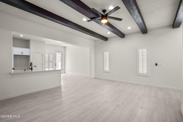 13866 Paseo Central Ave, El Paso, TX 79928 - unfurnished living room with beamed ceiling, a ceiling fan, baseboards, healthy amount of natural light, and recessed lighting