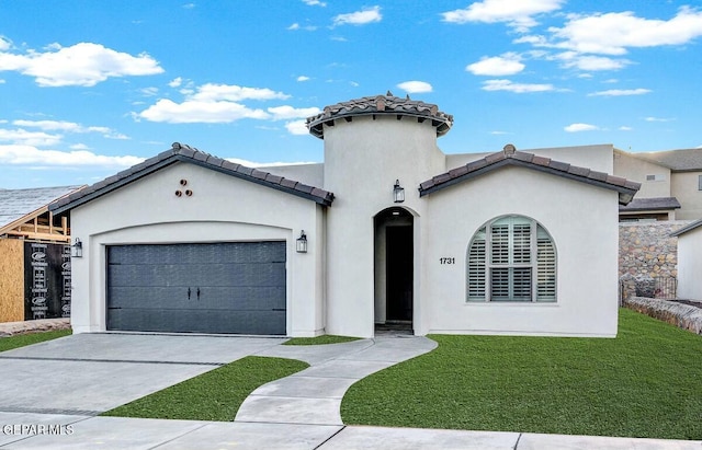 view of front of house featuring a garage and a front lawn